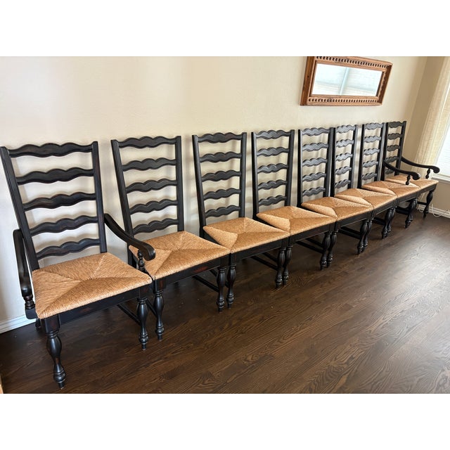A beautiful matching set of eight French Country style dining chairs, including two armchairs and six side chairs. Each...