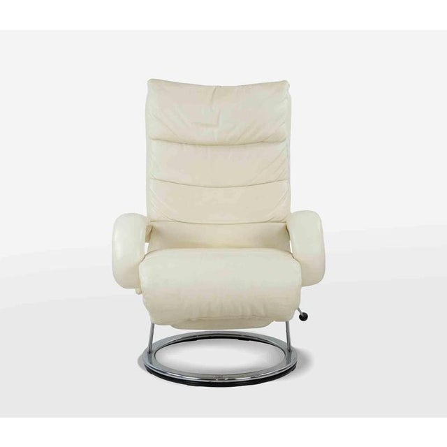 White leather relax armchair. Independently extractable footrest, reclining backrest, adjustable headrest, 360 degree...