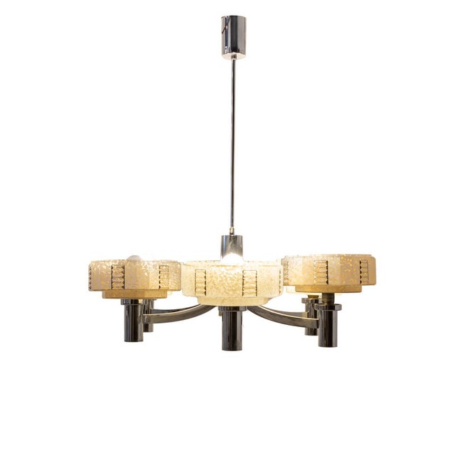 Portuguese ceiling lamp from the 1970s, made of steel and glass. It features a symmetrical hexagonal design. It consists...