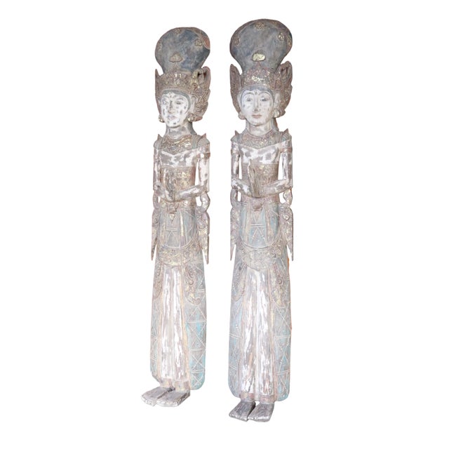 Beautiful pair hanging or standing decorative statues of Thai deities constructed from carved wood. The paint over time...