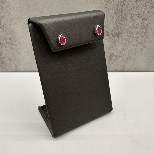 These elegant Bezel Set Ruby Studs in 14kt White Gold are the perfect blend of vibrant color and sophisticated design....