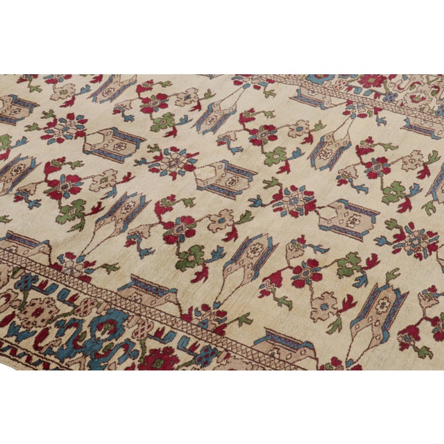 Hand-knotted in wool, this 5x7 vintage rug originating from Turkey, circa 1950-1960, is a very special piece, featuring a...