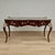 Impressive antique French Louis XV style desk expertly crafted in exotic kingwood veneer, featuring the original tooled...