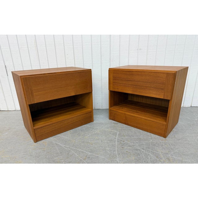 This listing is for a pair of Vintage Danish Modern Teak Nightstands. Featuring a straight line design, rectangular top,...