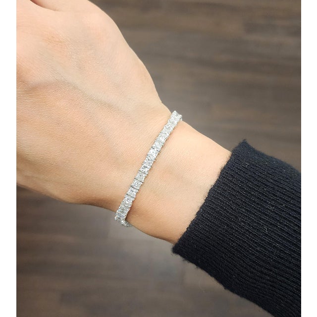 This exquisite tennis bracelet is a true embodiment of contemporary elegance, meticulously crafted to mesmerize with its...