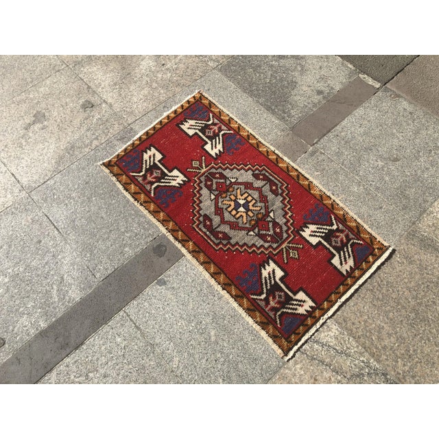 This is a vintage Turkish Oushak rug from the 1960s. The piece was hand-knotted.