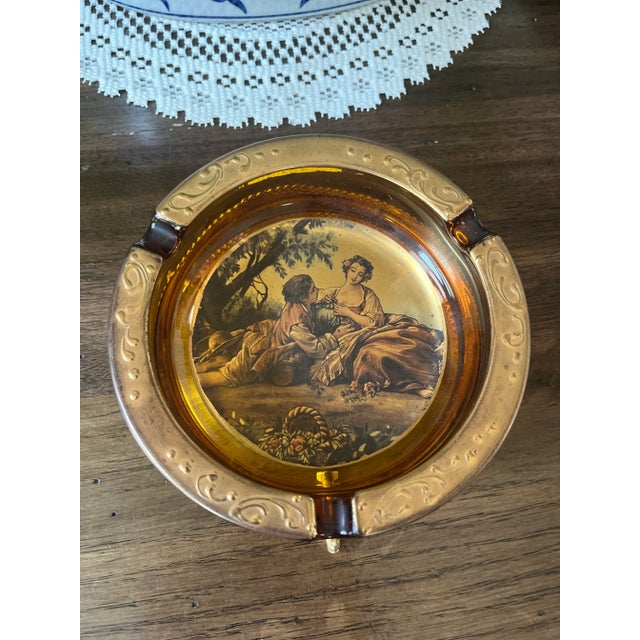 Vintage Italian Amber Glass Ashtray with Fragonard Lovers amber glass ashtray with Fragonard Lovers with gold plated in...