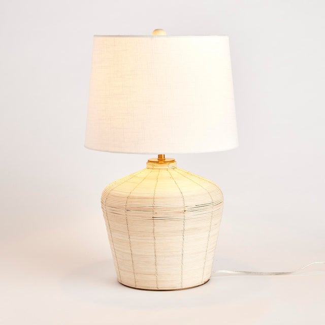 Woven in aWhitewash cane rattan, with subtle variations in color that makes each one truly unique, this lamp is an instant...