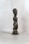 Hand-carved from indigenous wood, this figure comes from the Baule people of the Ivory Coast. Deeply rooted in Baule...