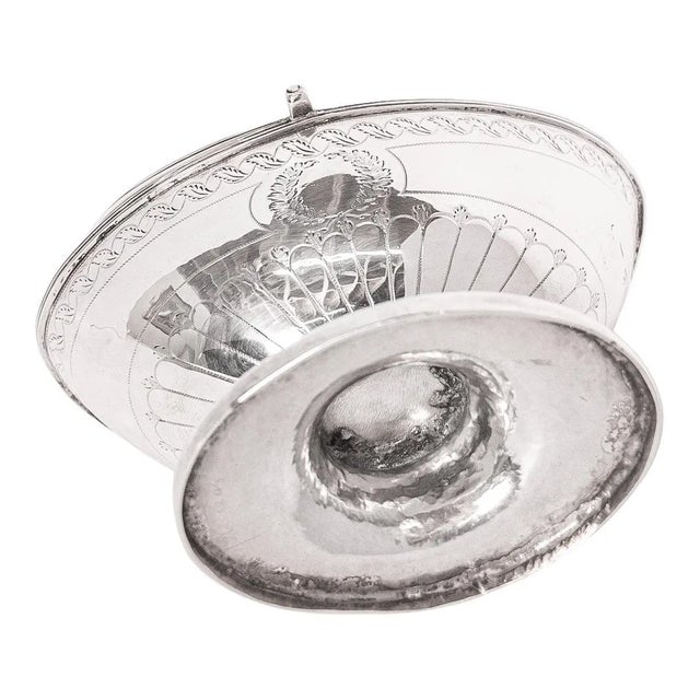 A fine antique Georgian sterling silver engraved sugar basket/bowl, London, circa 1790. The sugar basket of helmet shape &...