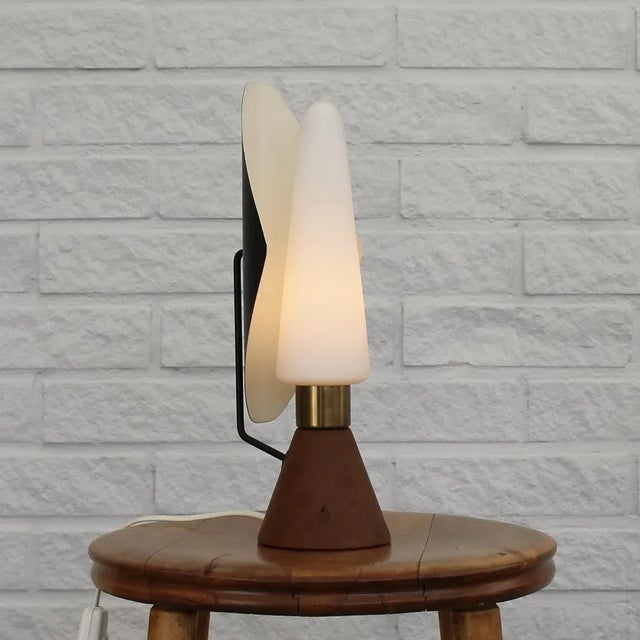 Rare asea table lamp, model e1296, dating back to the 1950s, featuring a cone-shaped base crafted from solid teak and an...