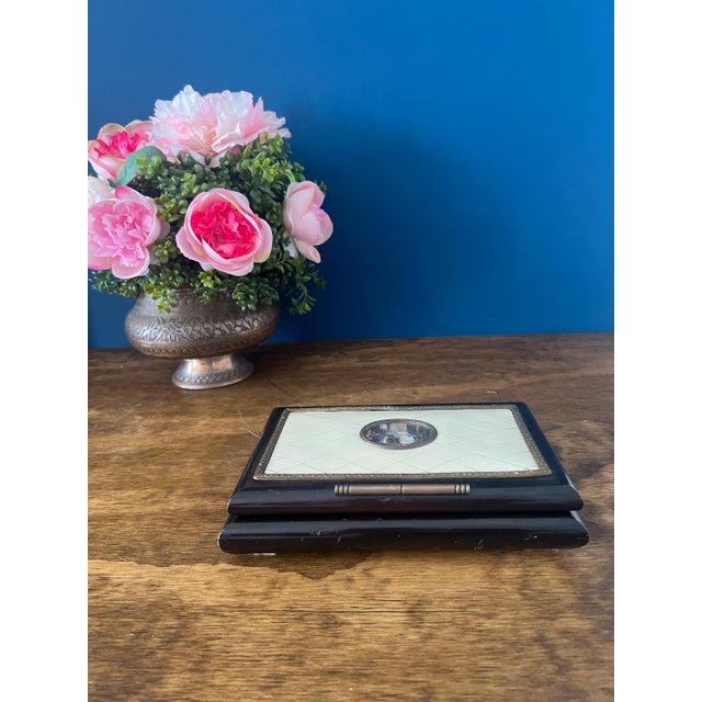 Antique Ebonized Wood Jewelry Box with Inlaid Faux Ivory Top & Painted Romantic Scene This exquisite antique jewelry or...