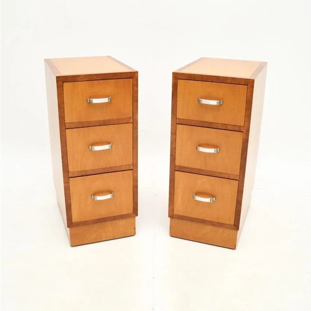A sleek and stylish pair of Art Deco satinwood and walnut bedside chests. They were made in England, they date from the...