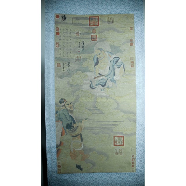 Buddhist deities among the clouds scroll, colored inks on heavy paper, mounted on a shimmering blue and silver, grey and...