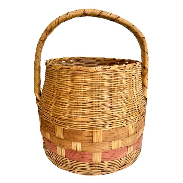 Antique French gathering basket. Light pink strip around the center. Perfect for magazines, firewood flowers. Sourced in...