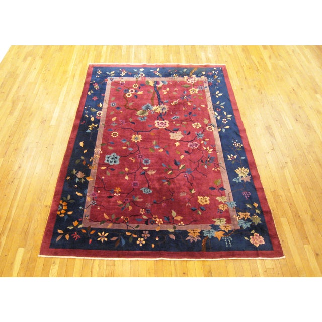 Antique Chinese rug, room size, circa 1920. A one-of-a-kind antique Chinese oriental carpet, hand-knotted with medium...