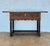Walnut console from the late 19th century with slat lid on a frieze with two drawer fronts decorated with carved and...