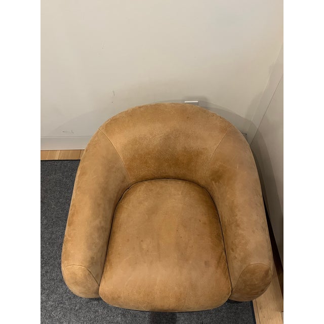 Seller's Notes: CB2 Laszlo swivel accent chair upholstered in caramel brown full-grain aniline leather with a natural oak...