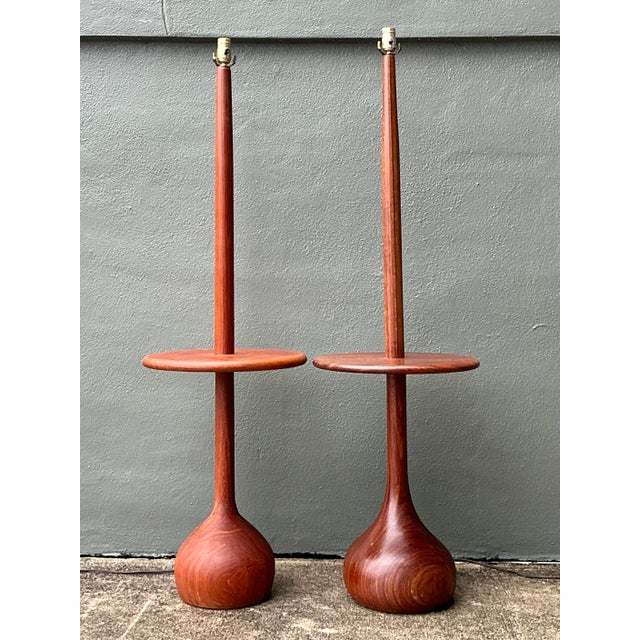 Capture the quintessential spirit of 1950s Scandinavian design with this rare and commanding pair of Danish teak floor...