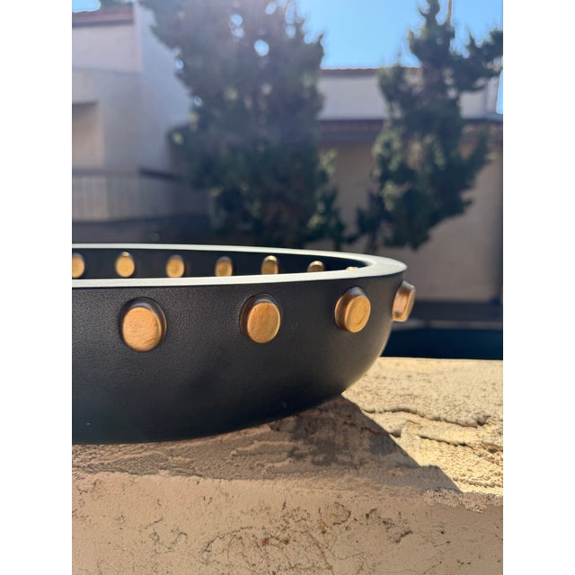 Make a bold statement with this stunning 18-inch L’OBJET studded centerpiece bowl, a sculptural luxury accent crafted with...
