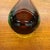 A striking vintage cased art glass bud vase dating to approximately 1965–1975. This elegant sculptural piece features a...
