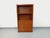 Vintage 1960s bookcase in dark oak, with a solid plinth, two open shelves, two sliding doors, and one large drawer at the...