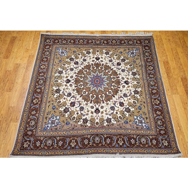 "A rare and exceptional find, this square-size Tabriz rug showcases the refined craftsmanship for which Northwest Persia...