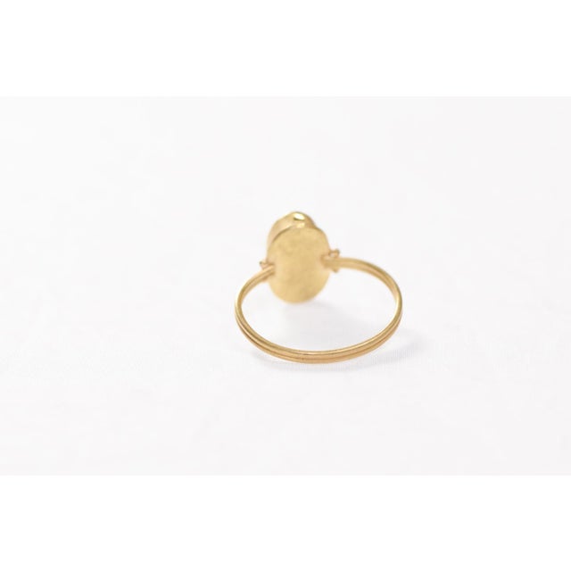 A Byzantine Bronze Cross, from between the IV and VI centuries, set in 21 Karat Matte Gold as a Fashion Ring. The...