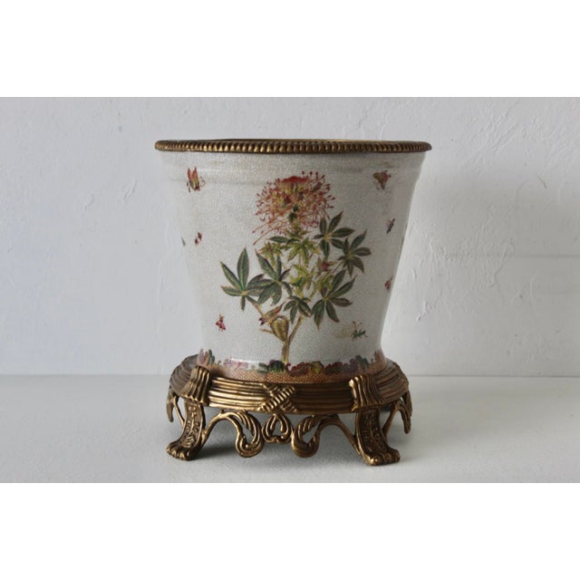 A vintage antique-style crackle-glazed porcelain planter or cachepot by Wong Lee, featuring floral and botanical motifs on...