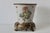 A vintage antique-style crackle-glazed porcelain planter or cachepot by Wong Lee, featuring floral and botanical motifs on...