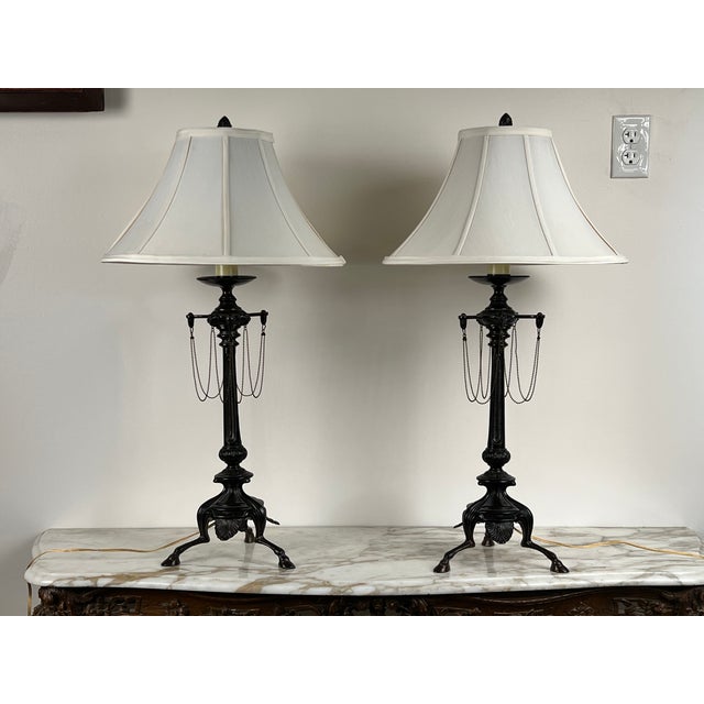 This vintage pair of French Empire Revival table lamps showcases the stately proportions and classical detailing...