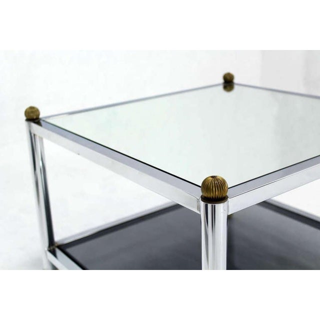 Pair of very nice chrome and brass base mid century modern end tables in style of M. Baughman. Fine brass finials and leg...