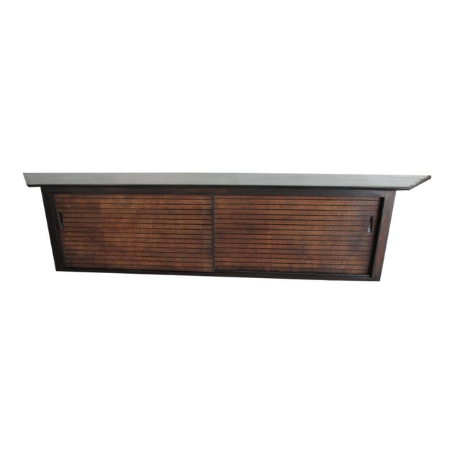 Sleek vintage custom made floating wall mount wooden console. Eight feet long. Features a pair of sliding doors which open...