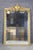 This magnificent monumental French giltwood mirror is a striking example of the grandeur and sophistication that defined...