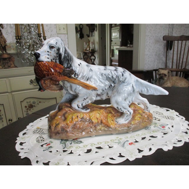 This vintage Royal Doulton figurine features a large English Setter hunting dog with a pheasant, designed by artist John...