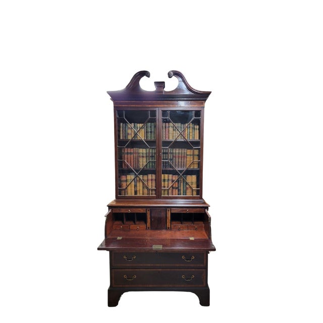 A Late Georgian Mahogany Secretaire C. 1810, with swan neck pediment over dentil molding and Tulipwood crossbanding. A...