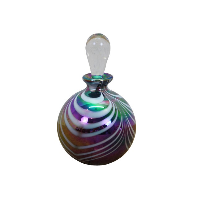 Vintage iridescent art glass perfume bottle featuring a bulbous body with white-and-purple swirled feather patterns and a...