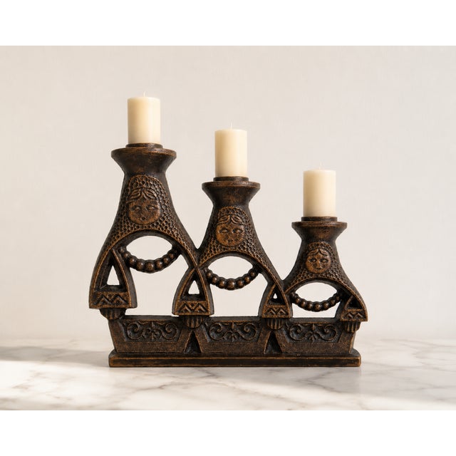 A striking and highly decorative three-light candelabra, crafted from heavy cast iron in the soviet union during the...