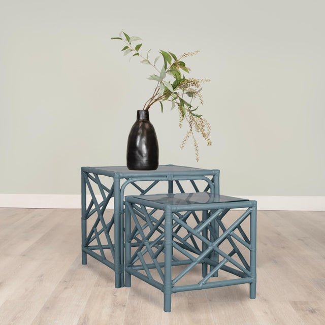 This exquisite set of rattan nesting tables blends classic chinoiserie charm with modern sophistication. Crafted with a...