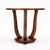 Side table from the Art Deco period in France. This piece has three curved legs that come together at the base. It is made...
