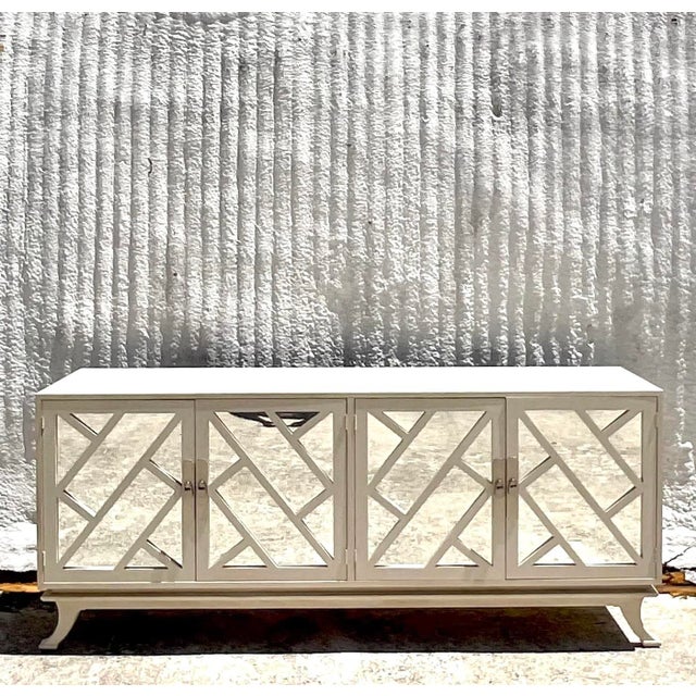 Bring a touch of coastal elegance to your home with the Vintage Coastal Chinese Chippendale Mirrored Credenza After...