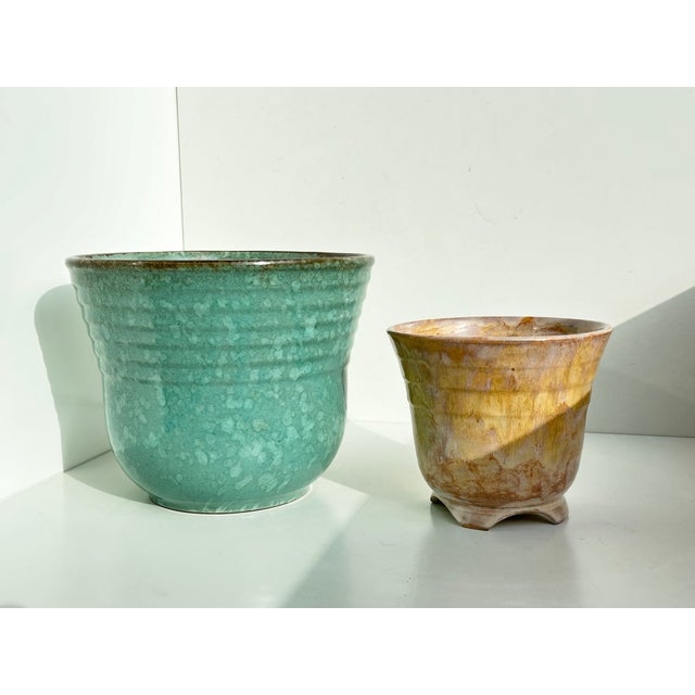 Elegant set of two vintage ceramic plant pots: one Mid-Century Modern piece in the glamorous Art Deco style and one...