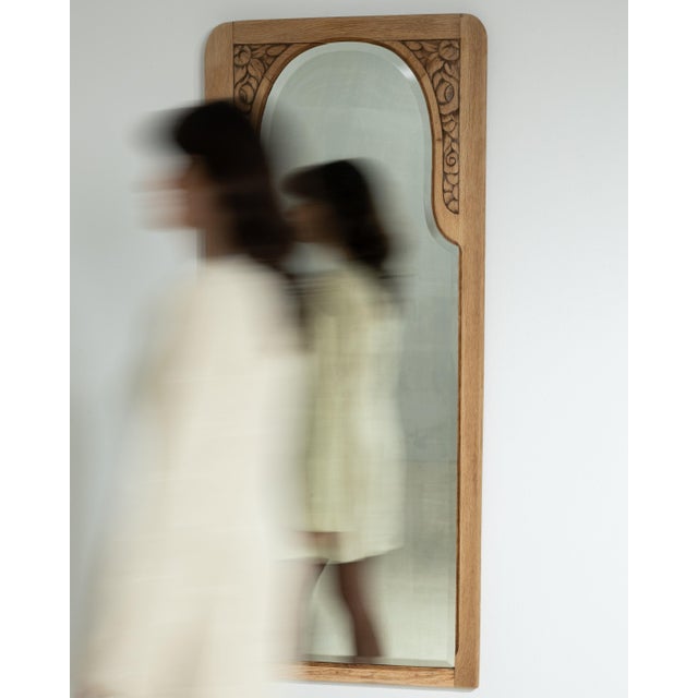 An early 20th century French Art Nouveau mirror, defined by gently curved lines and a balanced vertical composition. The...