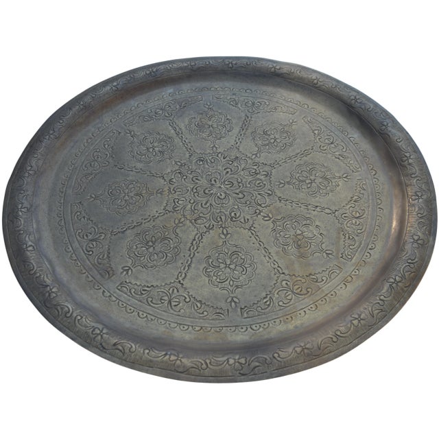 One-of-a-kind antique highly crafted, engraved and detailed Moroccan solid brass tray. Featuring an elaborate hand-...