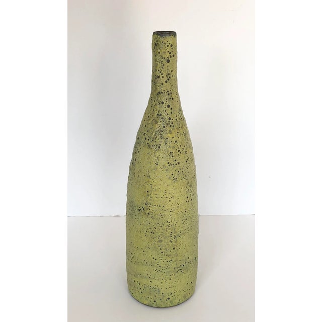 A beautiful Fat Lava Ceramic Pottery Vase/ Vessel, that has a very unique celadon color and surface structure. Signed at...
