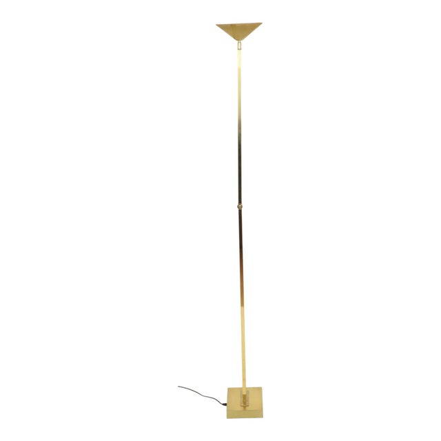 A stunning vintage floor lamp by Deknudt, crafted from gold-tone chrome-plated metal. It features a Hollywood Regency...