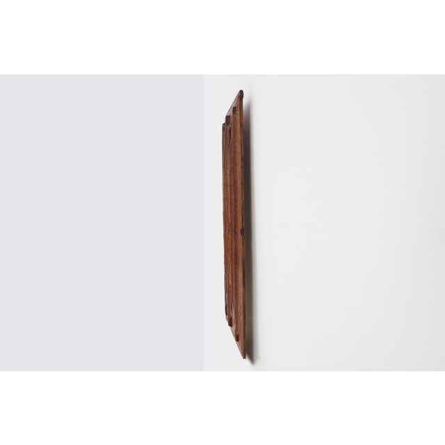 A finely carved oak panel from 16th‑century Flanders, featuring Gothic linenfold‑style fluting with pointed‑arch tops and...