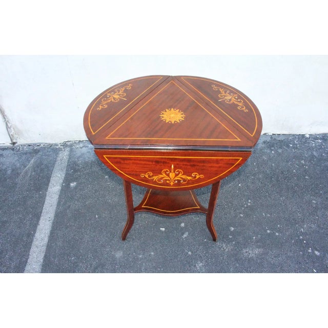 Gorgeous side end occasional accent table featuring an inlaid rectangular top with an inlaid center medallion and 3 drop...