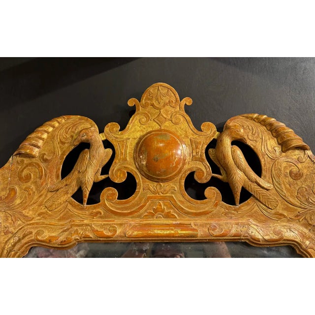 Very fine mid 18th century English Giltwood mirror. Seemingly all original with carved birds and Rosehead nails