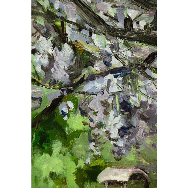 Wisteria captures a moment of serene connection with nature, as a woman reaches upward toward cascading blossoms. The...